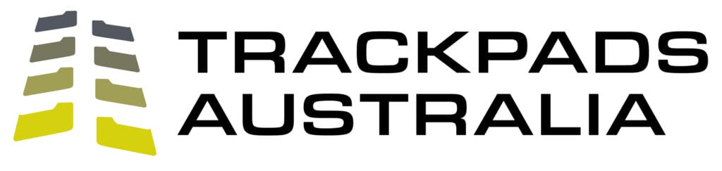 The logo features five staggered, angled shapes in varying shades of gray, olive green, and yellow on the left, with "TrackPads Australia" boldly written in black capital letters to the right. The white background gives it a clean finish.