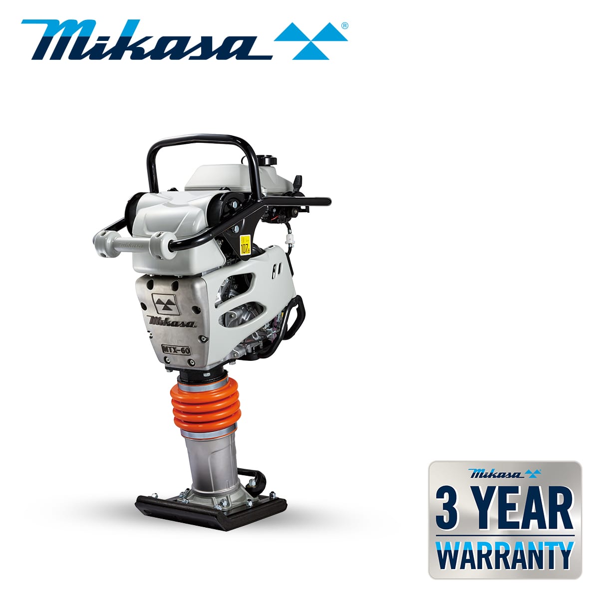 Image of a Mikasa MTX-60E tamper compactor with the Mikasa logo at the top and a "3 Year Warranty" badge to the bottom right. The machine has a compact design with an orange shock absorber and a sturdy metal handle.