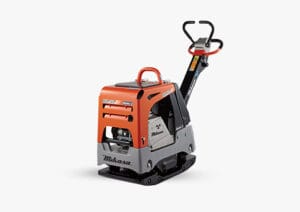 A compact orange and gray vibratory plate compactor with the brand name "Mikasa" visible on its side. The machine features a handle for maneuvering and a sturdy base designed for compacting soil, asphalt, or gravel on construction sites.