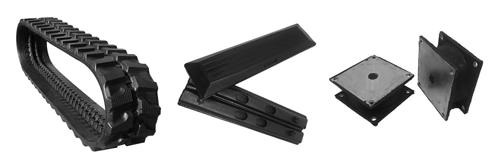 The image shows an assortment of industrial rubber and metal machinery parts from TrackPads Australia. From left to right: a large black rubber track, two black rubber pads stacked at an angle, and two black metal plates with a square and diamond-shaped design.