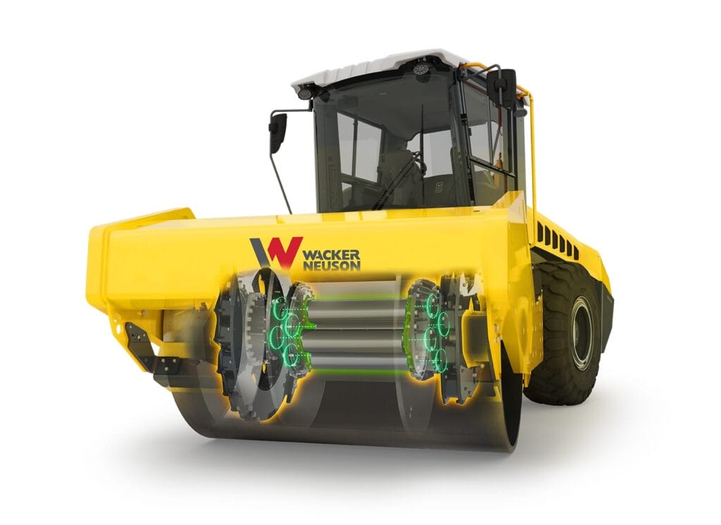 A yellow Wacker Neuson Series RC-2 construction vehicle with visible internal components is shown. It features large wheels designed for compacting surfaces, and the brand name is prominently displayed on the side.