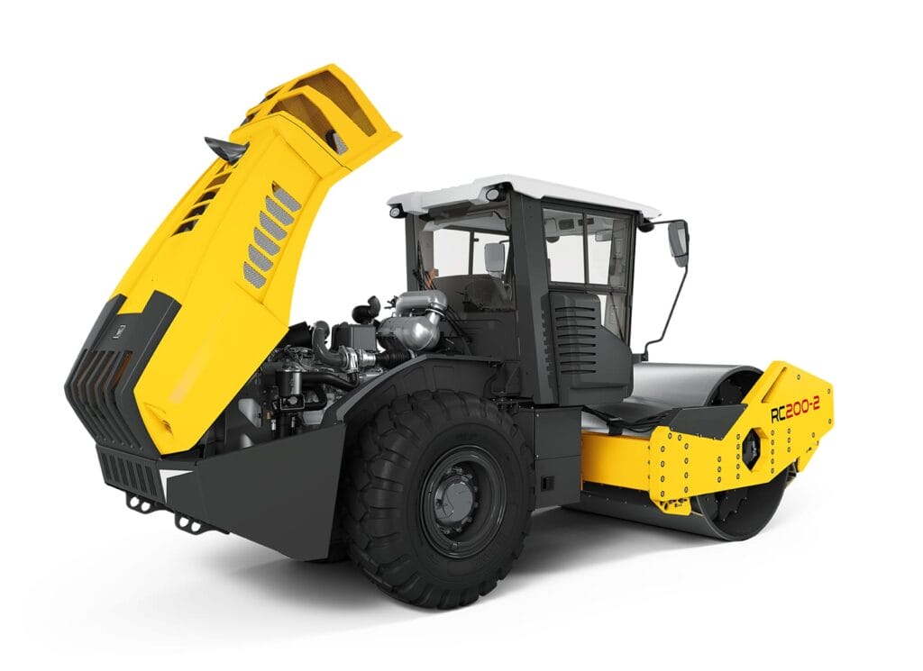 A yellow and gray industrial road roller with an open engine compartment showcases its machinery. Featuring large black wheels, it's designed for construction use. The model number Series RC-2 is visible on the side, marking it as part of a renowned line of equipment.